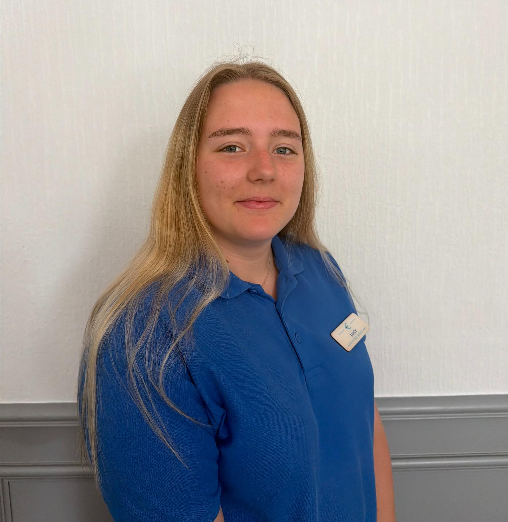 activities assistant with long blonde hair