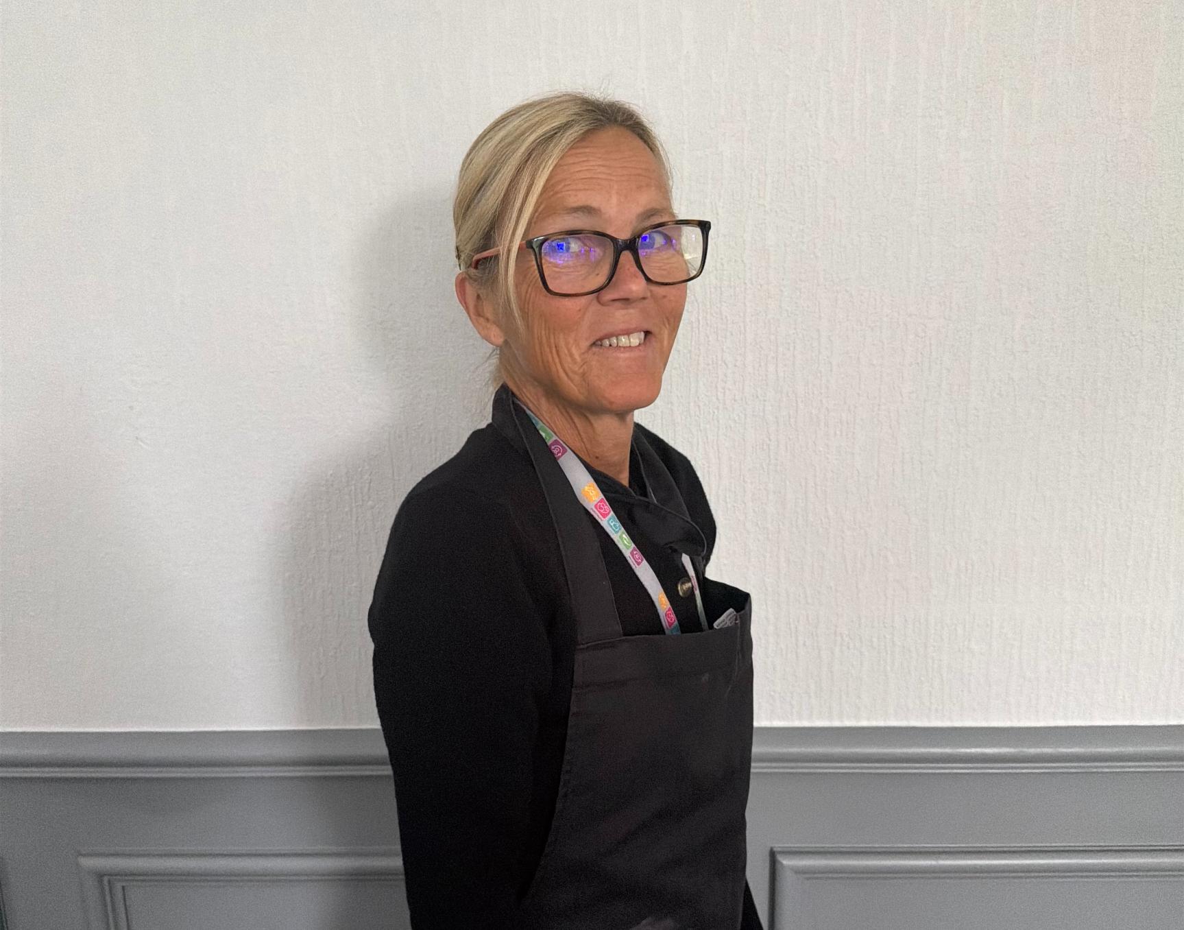 head chef in a care home with a black apron