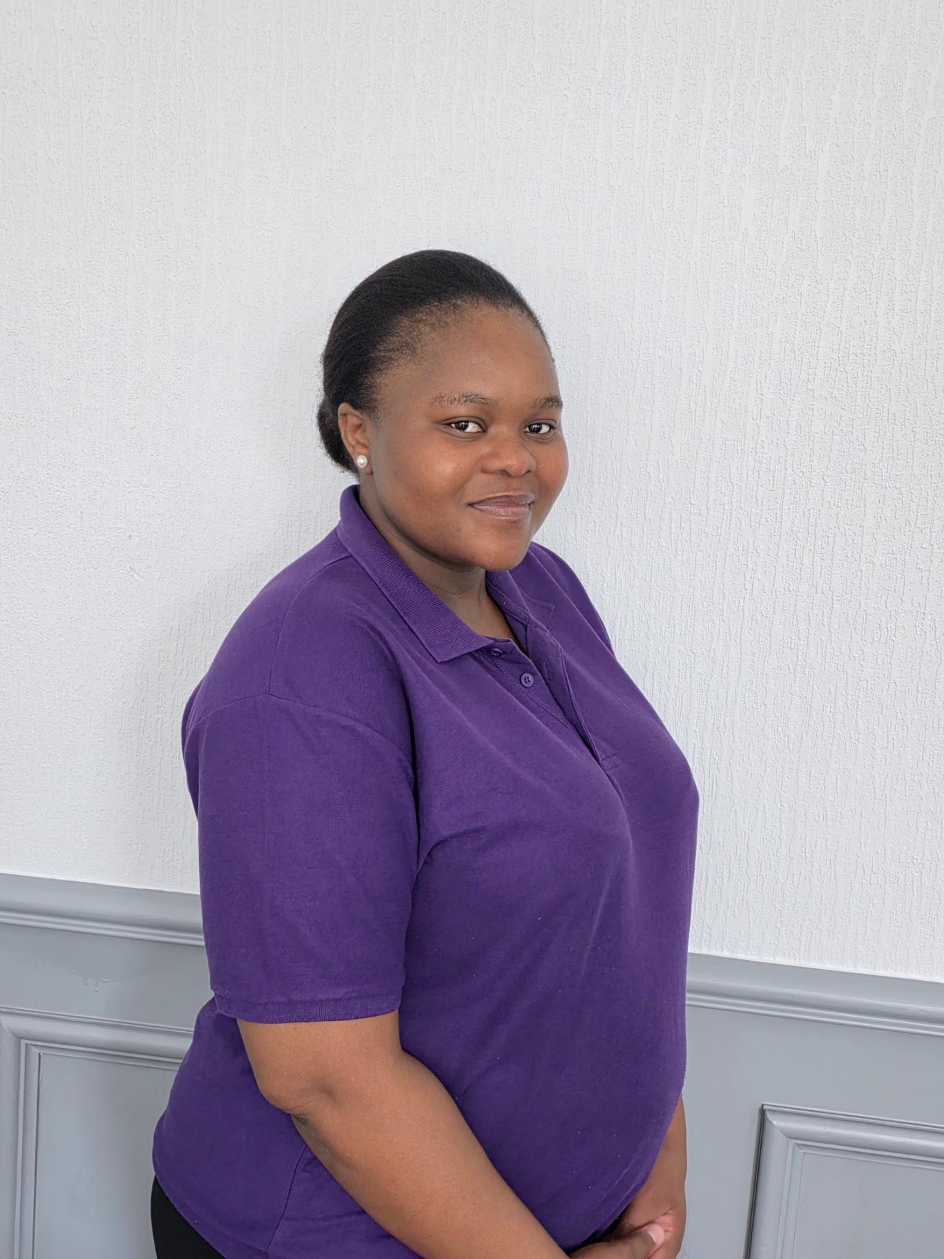 senior support worker in purple polo shirt