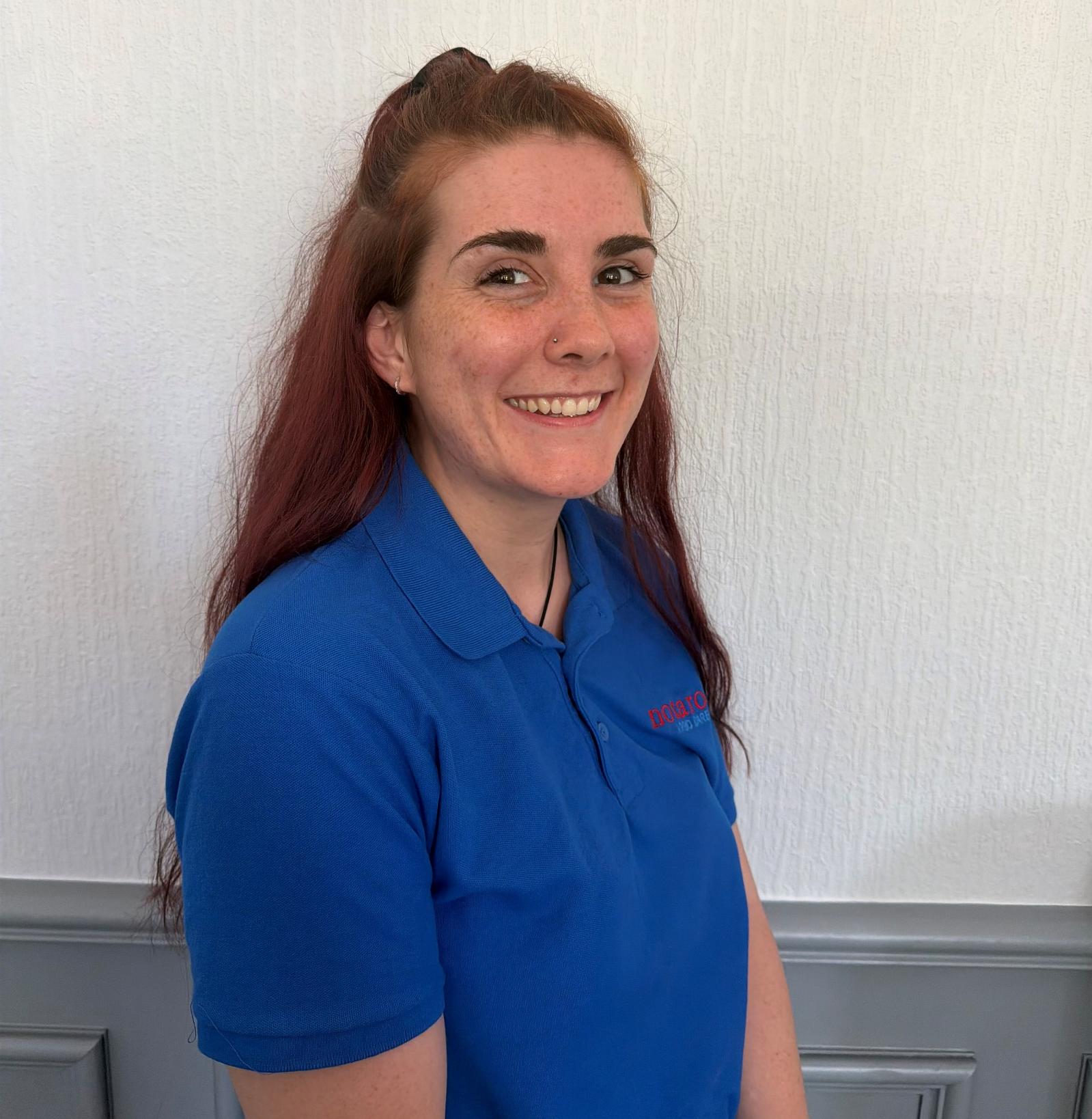 activities assistant in blue uniform