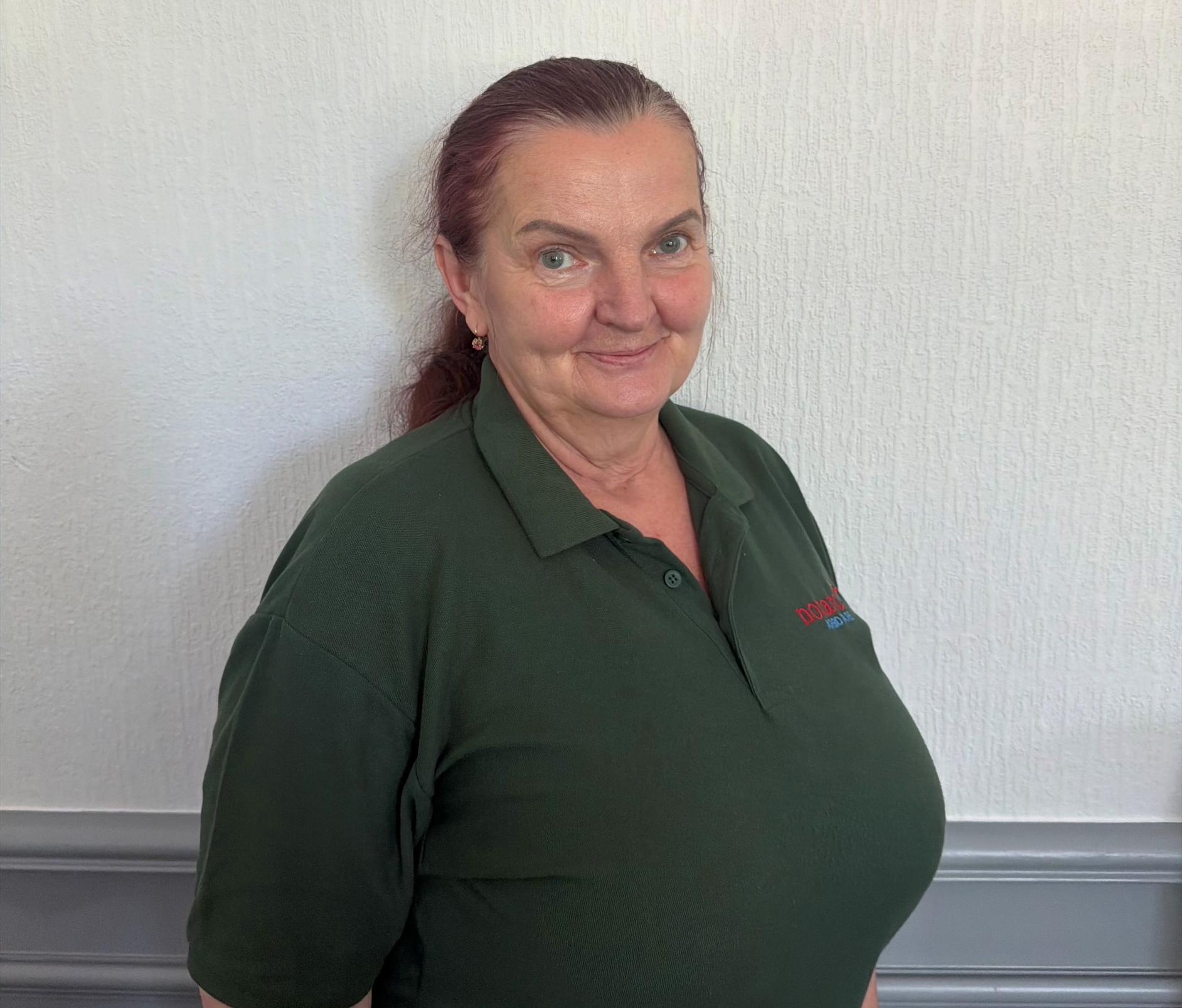 housekeeper in green uniform